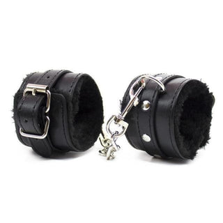 Take a look at an image of Fuzzy Leather Beginner Friendly Sex Handcuffs in black color, crafted from synthetic leather and plush materials.