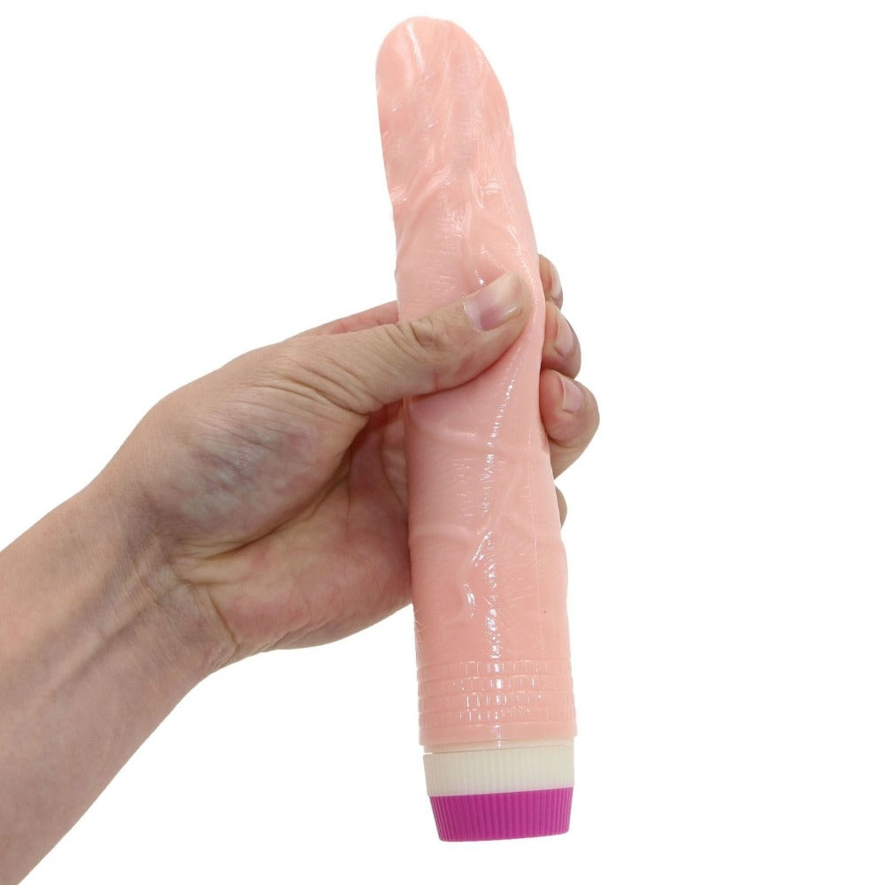 This is an image of a Flesh-colored silicone rotating dildo with adjustable vibration settings.
