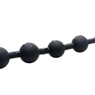 A picture of the Deep Sensations Silicone Long Ball String, constructed with medical-grade silicone for safety and comfort.