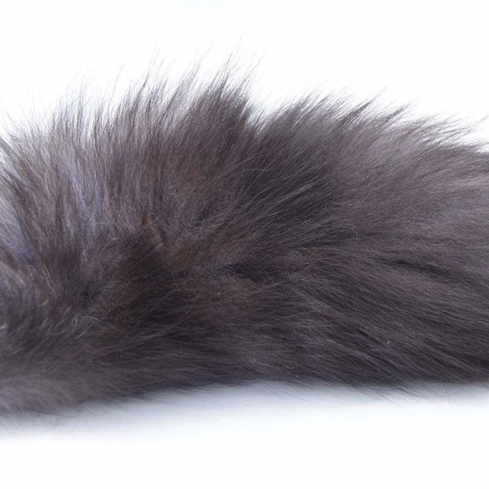 What you see is an image of Gray Fox Tail Plug 16 Inches Long displaying the non-porous, body-safe stainless steel material.