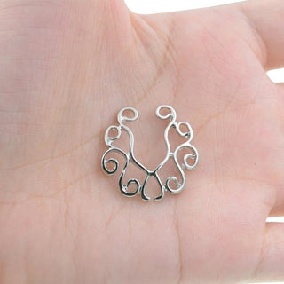Displaying an image of Sexy Stylish Clip-on Nipple Rings, a painless alternative for those seeking a spicy twist to intimate encounters.