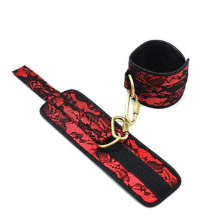 View a spreader bar with a touch of luxury, wrapped in red cloth and black lace for intimate exploration.