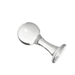 This is an image of a transparent glass anal plug with a ball-shaped head.