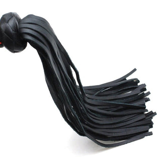 A picture of the BDSM flogger crafted from high-quality synthetic leather, offering guilt-free indulgence in dominance play.