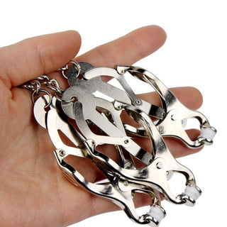 What you see is an image of Torture Trio Nipple Clamp Clit Chain with nipple and clit clamps for intensified sensations.