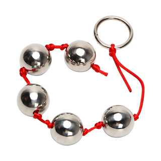 A visual representation of the hands-free experience with silver anal beads for intensified pleasure.