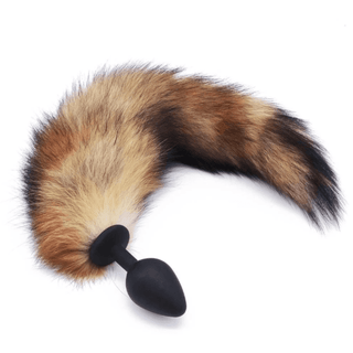 This is an image of Fox Tail Plug Silicone, Brown 17 with a flexible plug and a playful, life-like tail for passionate exploration.