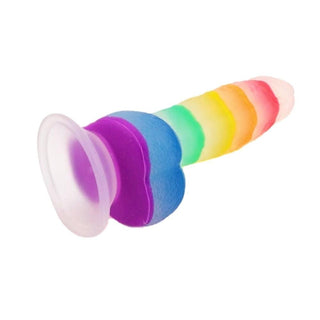 A close-up image of the 7.56-inch length and 1.34-inch wide rainbow dildo with suction cup and balls.