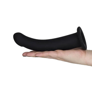 In the photograph, you can see an image of Smooth 6 Inch Black Dildo With Suction Cup with a flared base design for backdoor exploration and hands-free pleasure.
