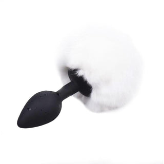 Silicone colored tail plug with faux fur tail, designed for comfort and pleasure, in pink and white color variations.