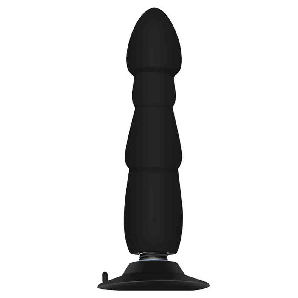 Rechargeable black silicone vibrating plug featuring deep textured ribs and a wide flared safety base.