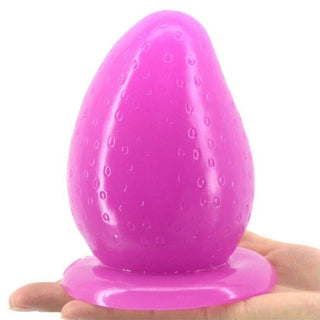What you see is an image of the Purple Strawberry Anal Dildo With Suction Cup - 4.92 inch length, 2.95 inch width, perfect for anal play.