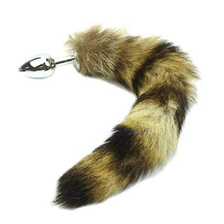 In the photograph, you can see an image of Sexy Faux Steel Raccoon Tail Plug 14 Inches Long with premium stainless steel plug and synthetic fur tail.