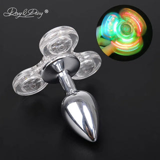Check out an image of Fidget Spinner Plug, a stainless steel butt plug with a transparent fidget spinner base and LED lights.