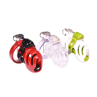 Pictured here is an image of Cum of Despair Silicone Cage, a red chastity device with four differently sized rings and a lock.