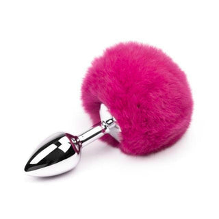Here is an image of Metal Rabbit Tail Dildo in pink color, offering a range of sensations for anal play enthusiasts with an exotic tail feature for tactile sensation.