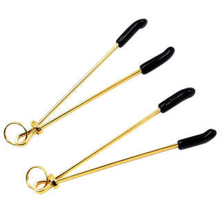 Feast your eyes on an image of Golden Nipple Clamps for Couples, featuring durable stainless steel construction with a gleaming golden finish and black rubber-tipped ends for secure and comfortable fit.