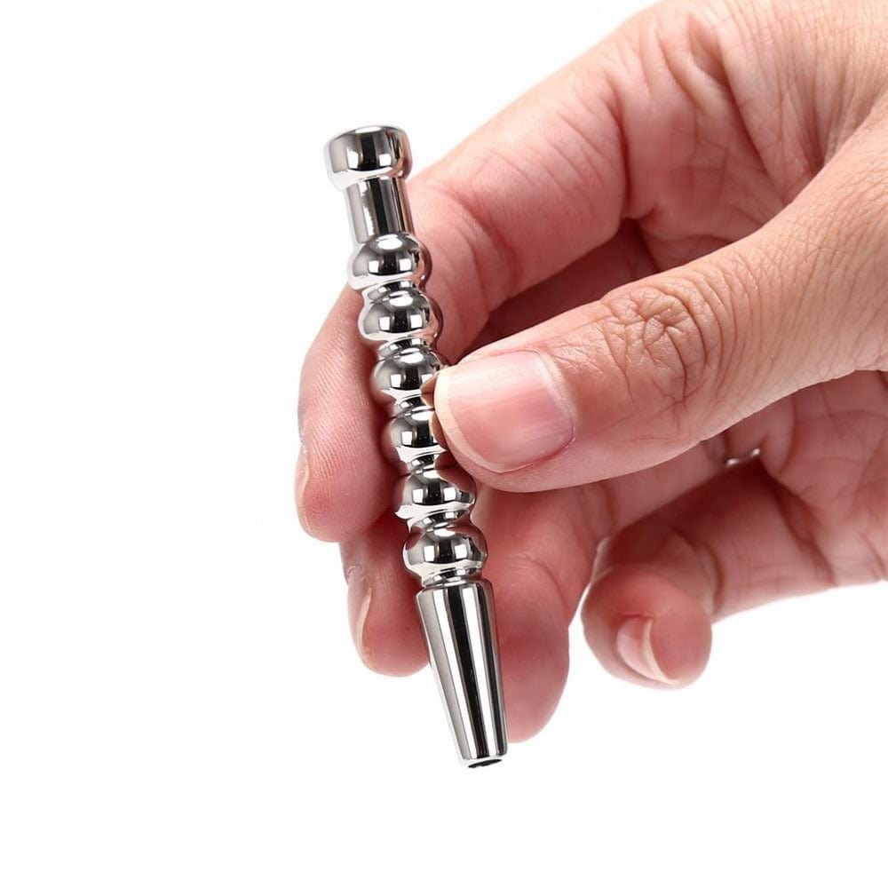 Displaying an image of Ribbed Stainless Hollow Penis Plug for an unforgettable erotic adventure.
