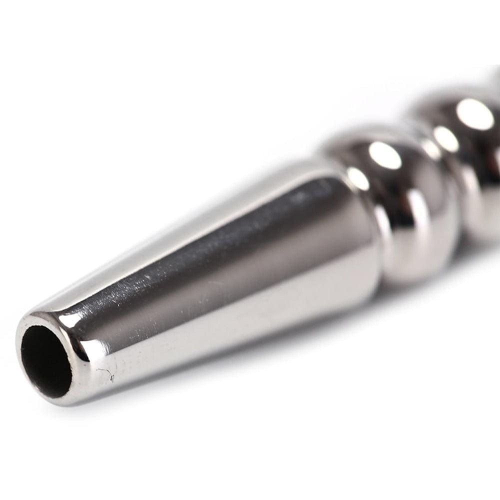 Take a look at an image of Ribbed Stainless Hollow Penis Plug in silver color for a stylish intimate experience.