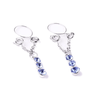 A close-up of stainless steel faux nipple rings with sparkling blue jewels for a stylish and sensual touch.