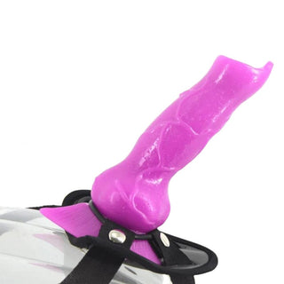 Observe an image of a purple wolf dildo with a tapered tip, perfect for G-spot or prostate stimulation, and a delicious stretch for fullness.