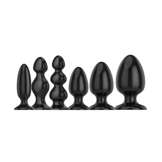 Black silicone butt trainer with tapered design, 4.92 to 6.92 inches long.