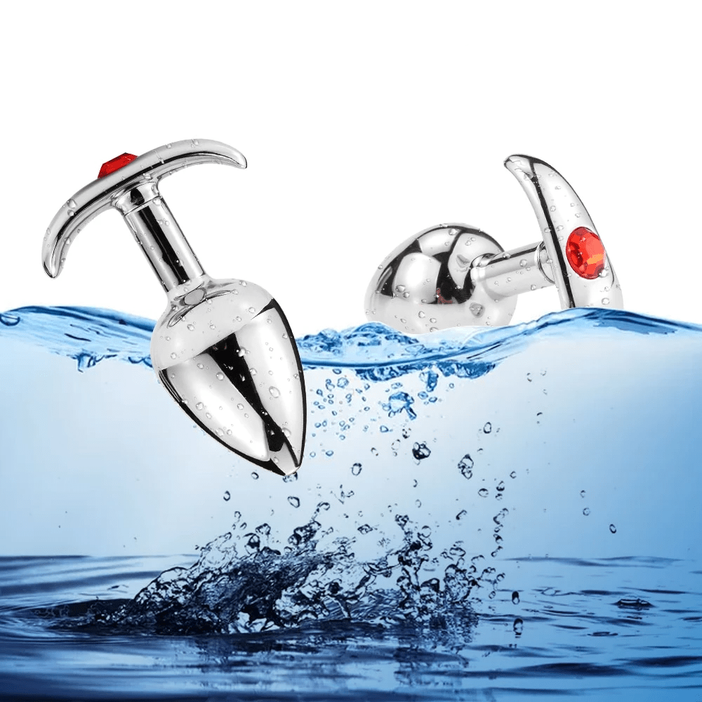 Pictured here is an image of Anchor-Inspired Princess Metal Jeweled Butt Plug crafted with precision for pleasure, featuring a smooth surface and lightweight feel for effortless gliding and stimulation.