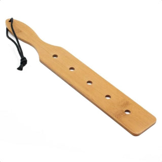 You are looking at an image of All-Natural BDSM Starter Wooden Paddle With Holes, handcrafted from bamboo for sensual dominance.