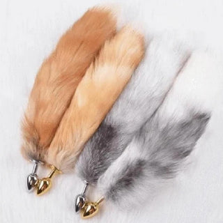 Here is an image of Elegant Fox Tail Plug 19 Inches Long with a sleek stainless steel plug in gold color.