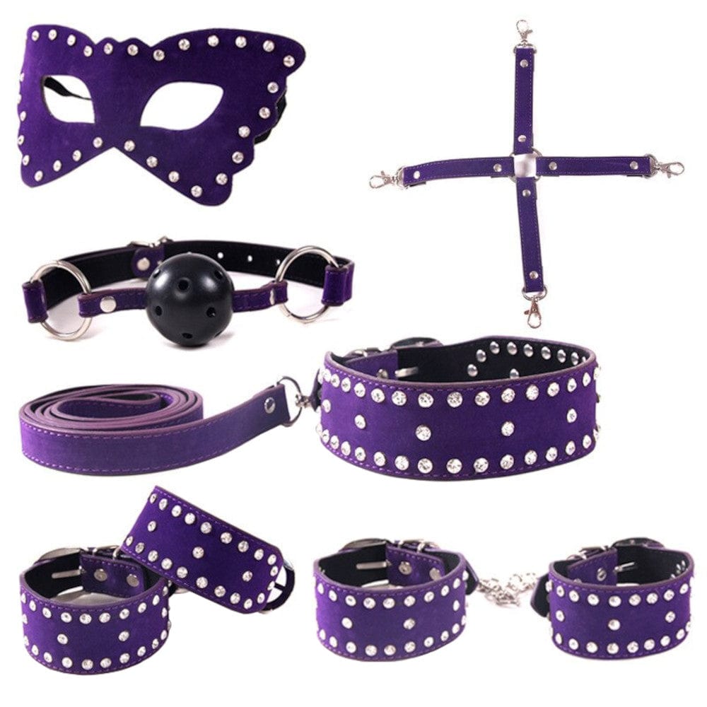 Check out an image of Fit for Royalty Leather Self-Restraint Bondage Kit for BDSM featuring diamond-studded cuffs, plush mouth gag, and butterfly paddle for elegant exploration of fantasies.