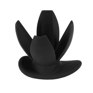 In the photograph, you can see an image of Petal Style Expanding Plug Hollow For Men Silicone 3.35 Inches Long in sleek black option.