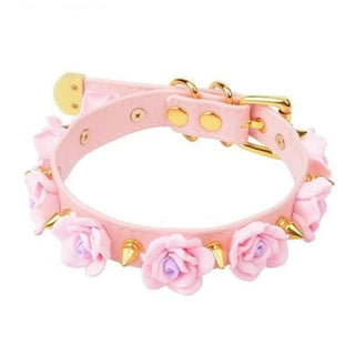 Pictured here is an image of Flowers and Spikes Cute Collar in pink with gold spikes, showcasing a blend of innocence and edginess.