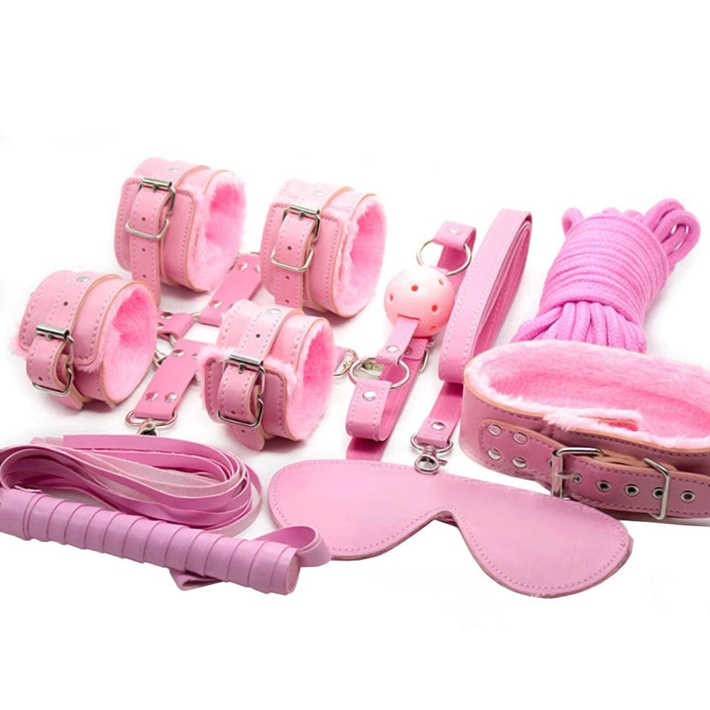 What you see is an image of Sugar and Spice Pink Leather Body Bondage Set with BDSM Rope Play Restraints featuring adjustable handcuffs, ankle shackles, and rope for versatile play.