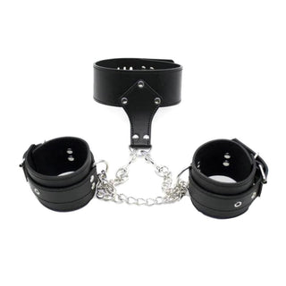 Check out an image of Bondage Role Play Collar with black leather strap and silver studs, adjustable circumference, and hanging D-ring for accessories.