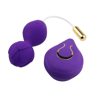 You are looking at an image of Blooming Rose Remote Control Kegel Balls, showcasing the USB charging capability and the compact dimensions of the vibrator and remote control.