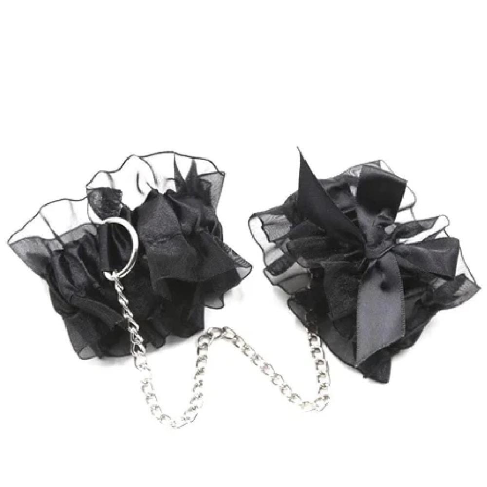A sensual image of the Racy Daisy 3-Piece Lace BDSM Gear Set with Bondage Restraints showcasing silk blindfold, lace nipple covers, and adjustable handcuffs for erotic play.