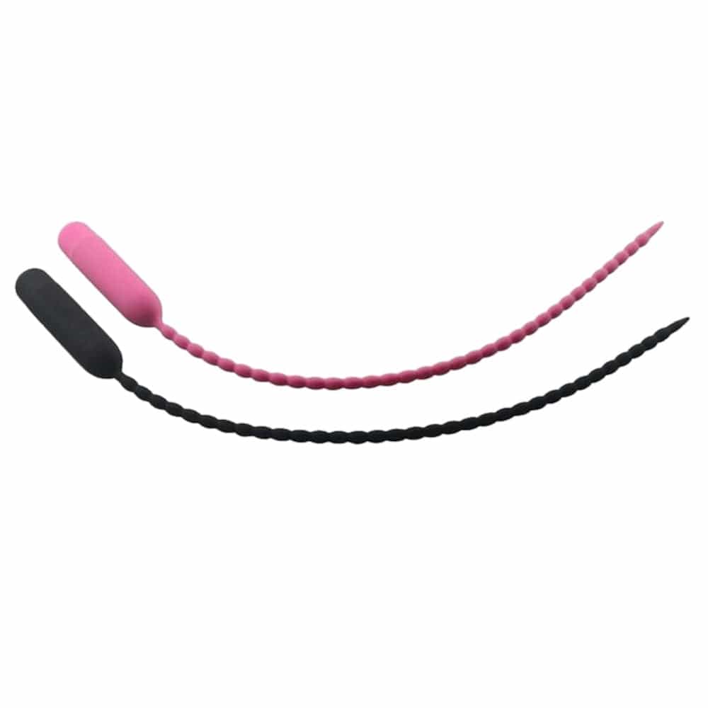 This is an image of a pink and black Silicone Penis Plug with beaded texture