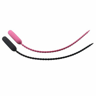 This is an image of a pink and black Silicone Penis Plug with beaded texture