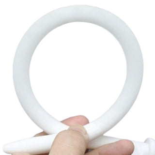 View a white silicone penis plug designed for intimate adventures and prostate stimulation