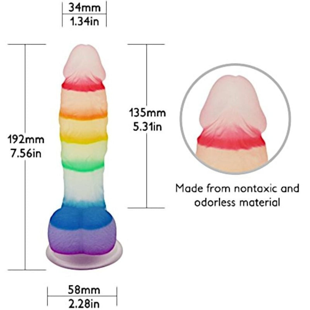 A fun image of the rainbow dildo with suction cup sticking to a flat surface for solo play.