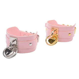 You are looking at an image of Oversized Girly Pink Leather Collar with heart-shaped pendant in silver and gold options.