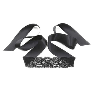 A captivating image of the Racy Daisy 3-Piece Lace BDSM Gear Set with Bondage Restraints in black color, featuring adjustable silk blindfold, lace nipple covers, and handcuffs for an unforgettable experience.