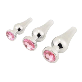 Explore the world of pleasure with the Silver Cone-Shaped Princess Jeweled 3-Piece Set Trainer Huge, a statement piece in jewel tones and stainless steel construction.