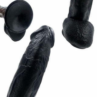 Huge 12 inch silicone dildo with lifelike shaft and suction cup feature.