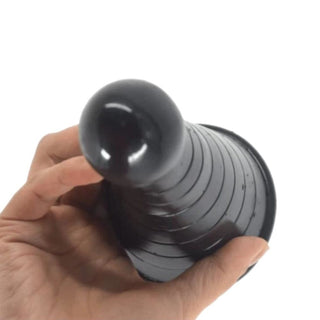 This is an image of the Big Bad Cone-Shaped Anal Plug, 7.5 inches long, gradually thickening from 1.6 to 3.1 inches, perfect for filling empty corners and enhancing anal play.