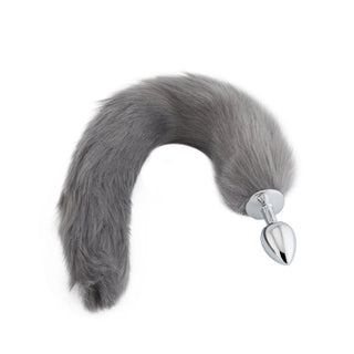 Presenting an image of Frosty Gray Wolf Tail Plug with elegant synthetic fur tail and stainless steel plug for wild adventures.