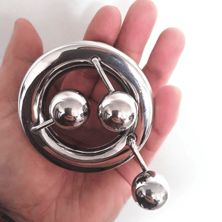 Silver stainless steel ball stretcher with 1.46 inches interior diameter and 2.32 inches exterior diameter.