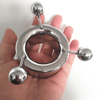 Heavy duty metal ball stretcher for elevated intimate encounters.