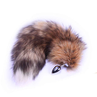 Presenting an image of Realistic Fox Tail Plug 18 Inches Long with a brown faux fur tail and silver stainless steel plug.