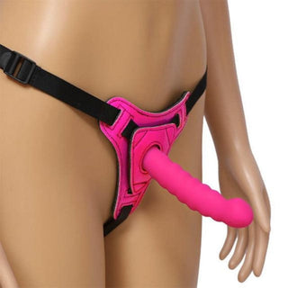 Displaying an image of Pretty Pink Harness With Dildo, showcasing a comfortable fit with high-quality nylon straps and a soft, textured silicone dildo.